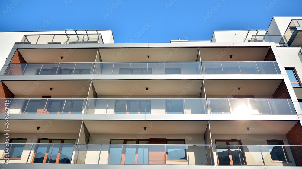 Contemporary residential building exterior in the daylight. Modern apartment buildings on a sunny da