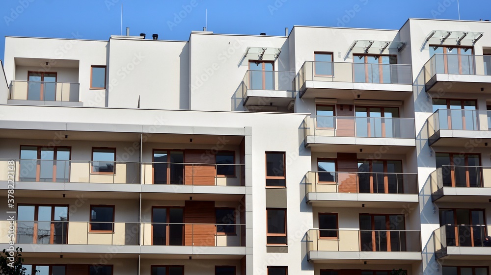 Contemporary residential building exterior in the daylight. Modern apartment buildings on a sunny da