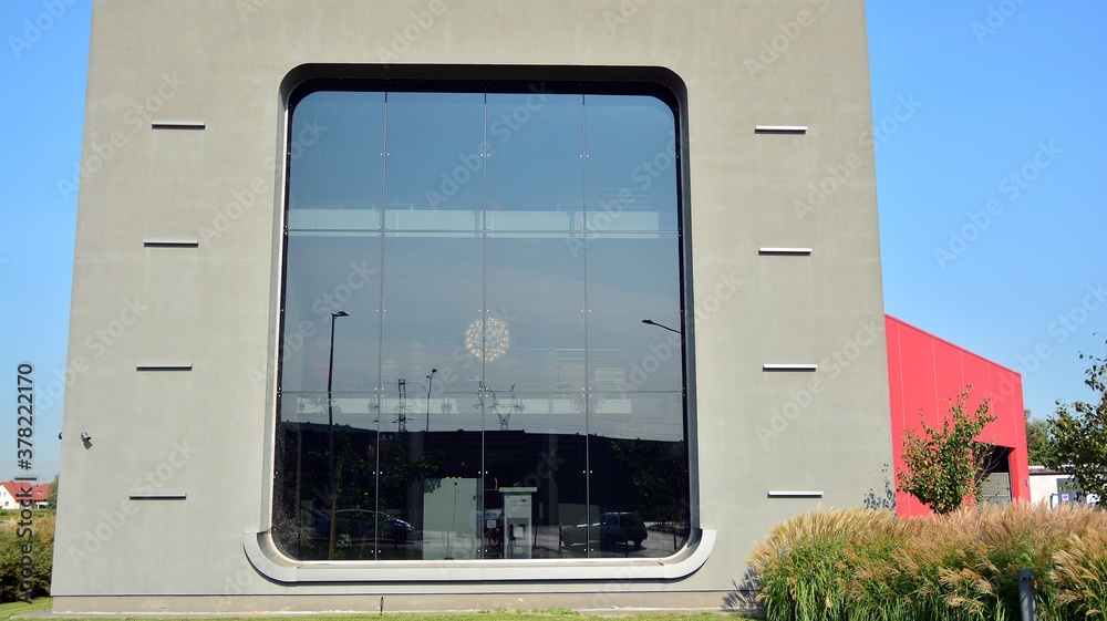 Facade texture of a glass mirrored office building. Fragment of the facade. Modern architecture of t