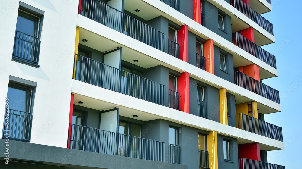 Contemporary residential building exterior in the daylight. Modern apartment buildings on a sunny da