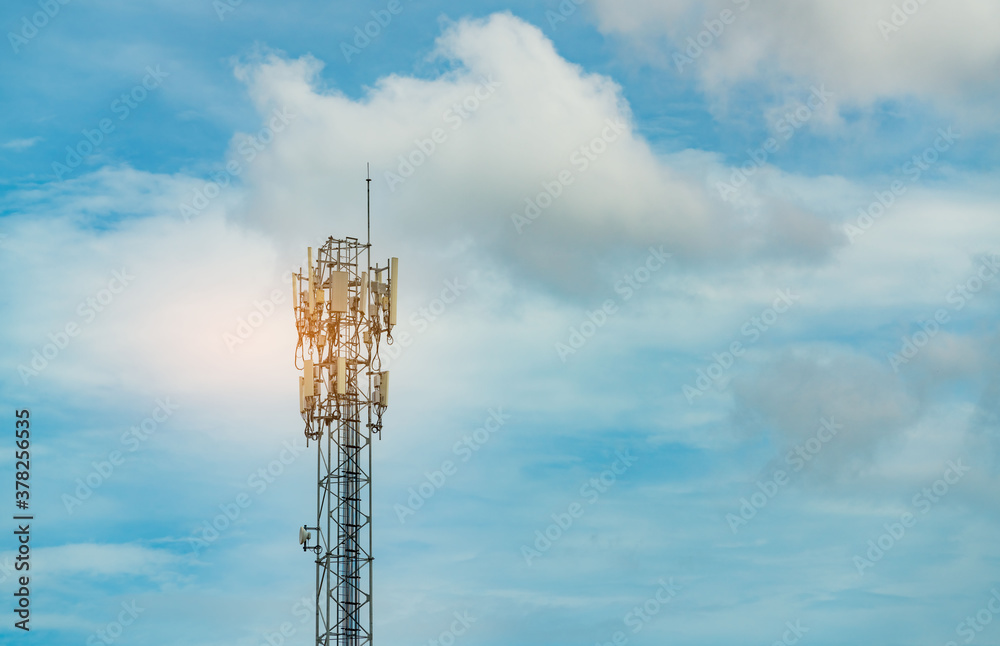 Telecommunication tower with blue sky and clouds. Antenna. Radio and satellite pole. Communication t