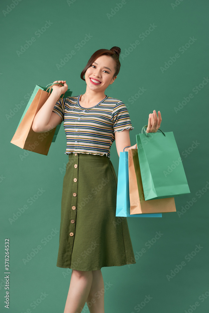 attractive happy stylish woman shopaholic walking holding shopping bags