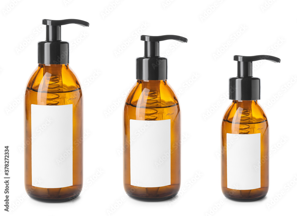 Cosmetic products in bottles of different sizes on white background