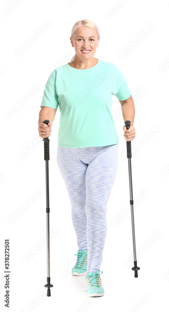 Mature woman with walking poles on white background