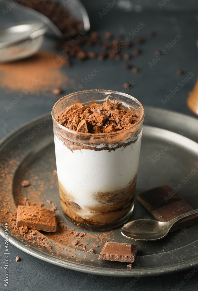 Tasty tiramisu on dark table