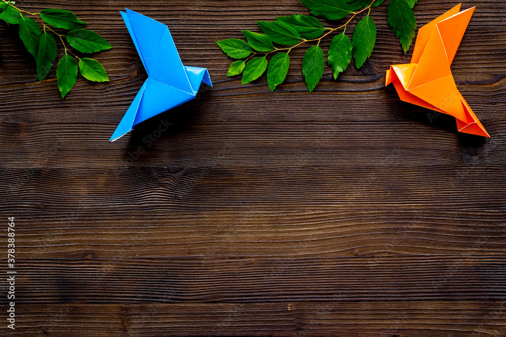 Paper pigeons in origami technique. DIY creativity. View from above