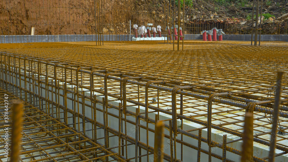 CLOSE UP: Ground floor of a house under construction waits for slab pouring.