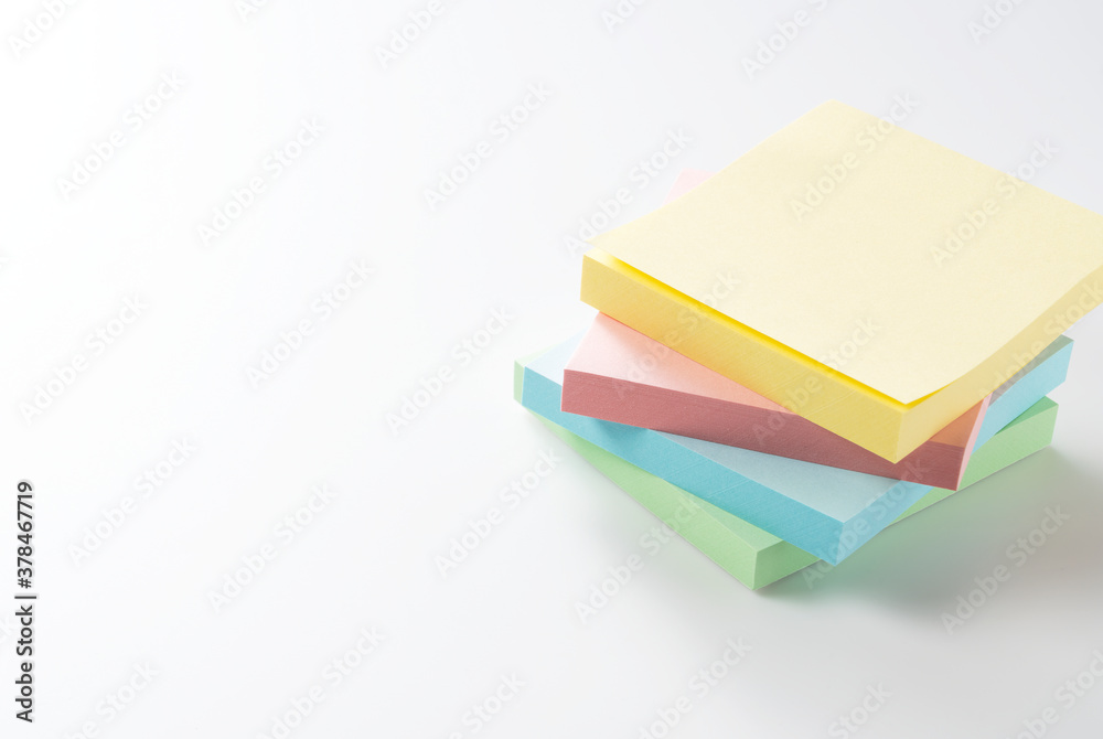 Four colorful sticky notes on a white background