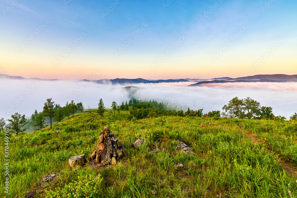 The morning  fog between the mountains landscape.