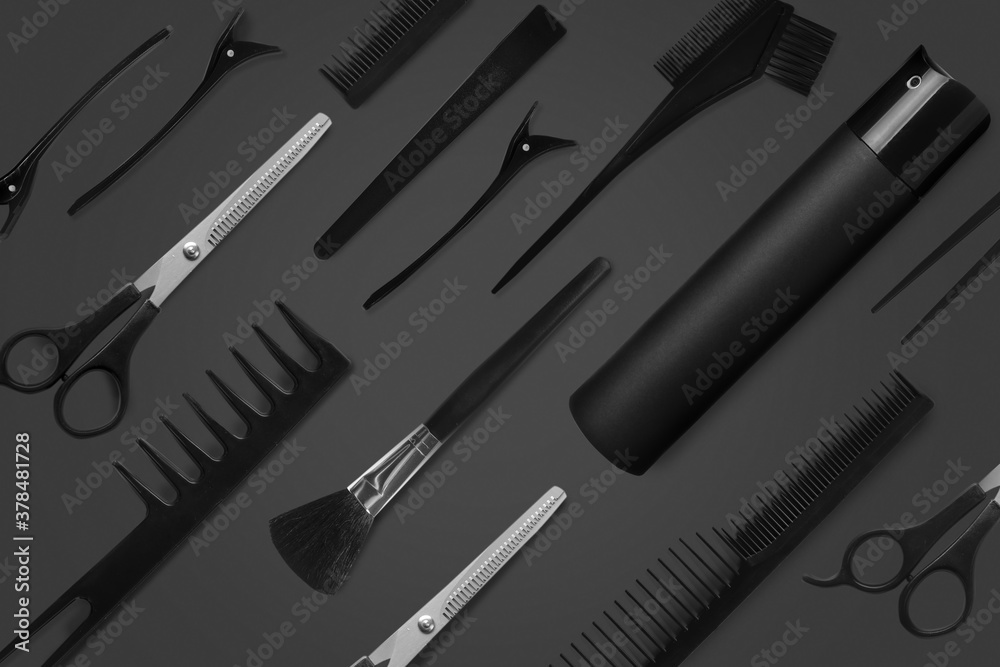 Set of hairdressers accessories on dark background