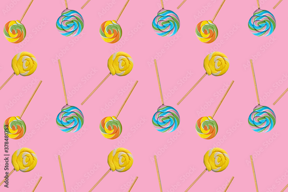 Different tasty lollipops on color background