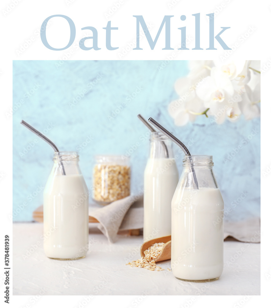 Bottles of tasty oat milk on table