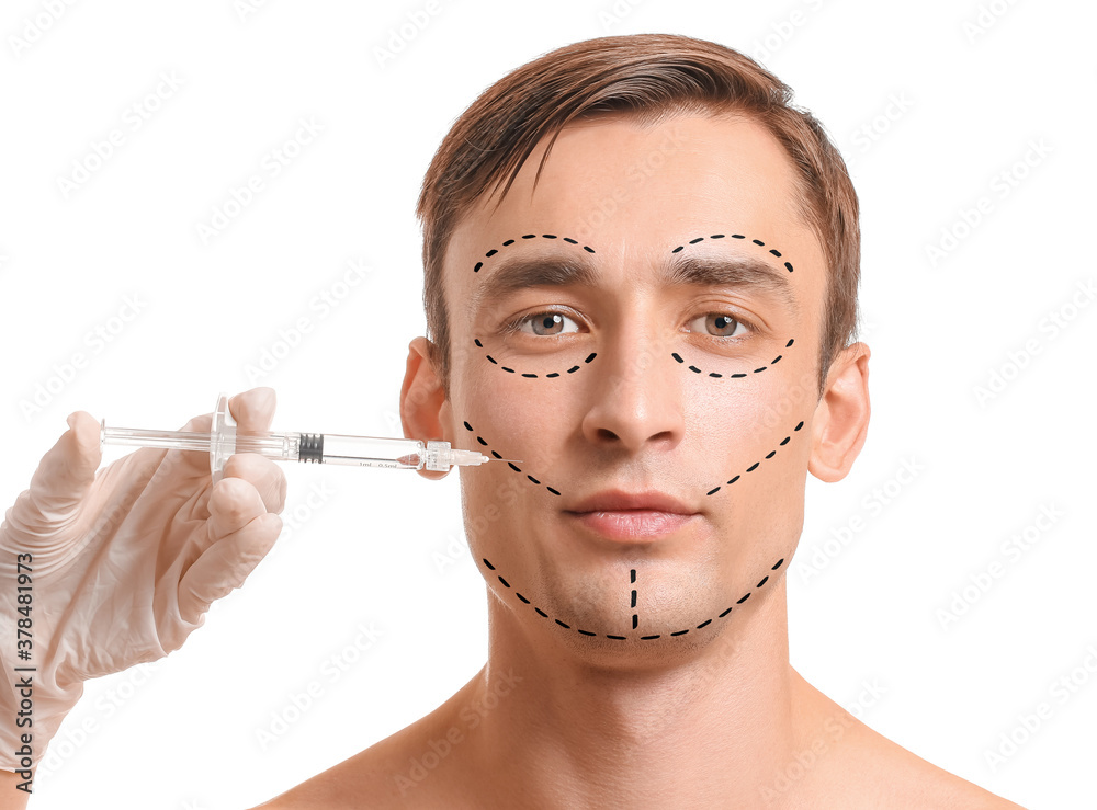 Handsome man receiving filler injection on white background