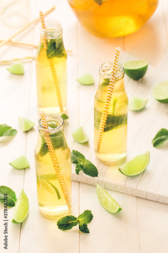 Bottles of fresh ice tea on table