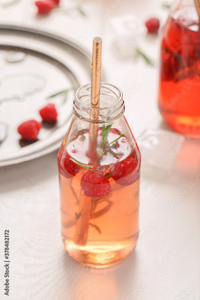 Bottle of fresh ice tea on table