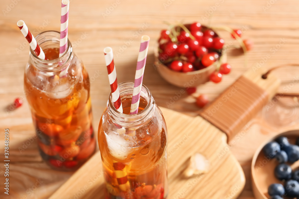 Bottles of fresh ice tea on table