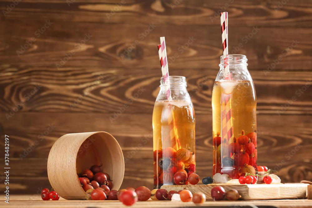 Bottles of fresh ice tea on table