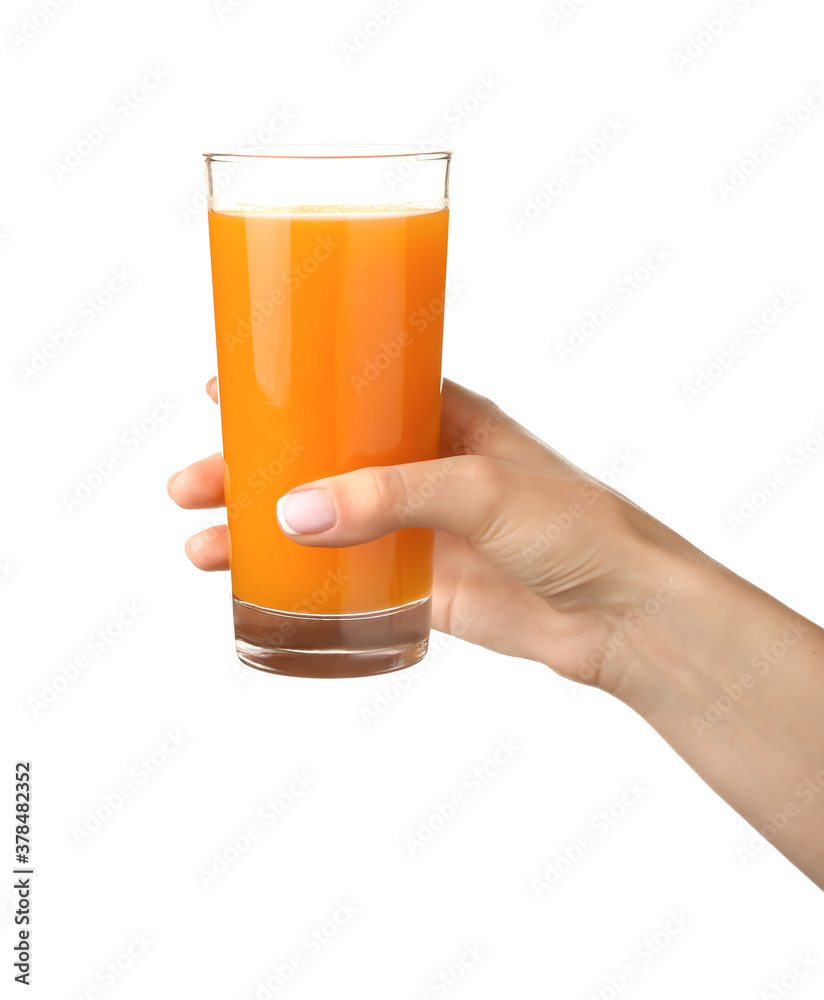 Hand with glass of fresh juice on white background