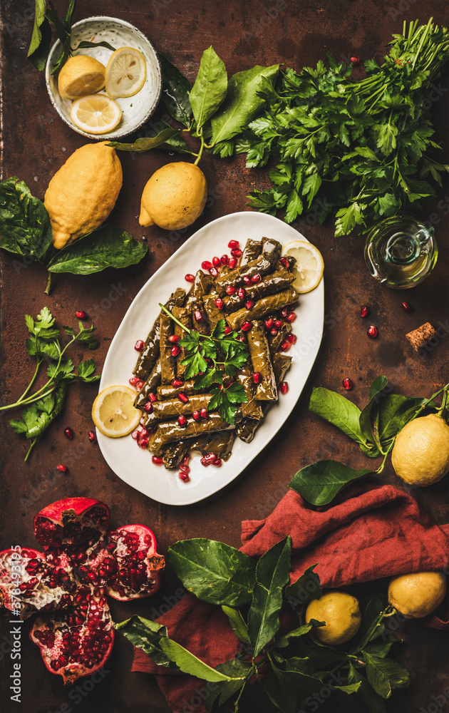 Turkish traditional starter meze. Flat-lay of Sarma wine leaves filled with rice and spices with pom