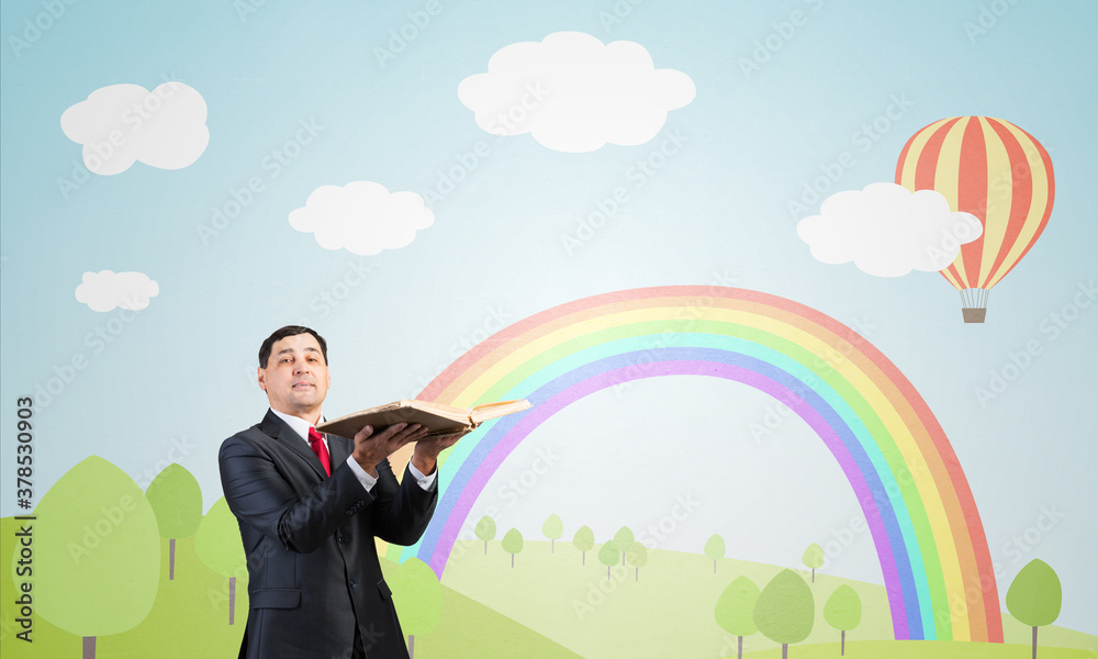 Happy businessman holding open book