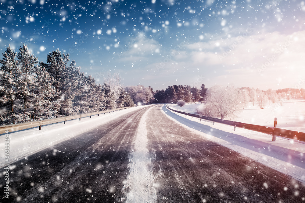 winter road, covered with snow on sunny day