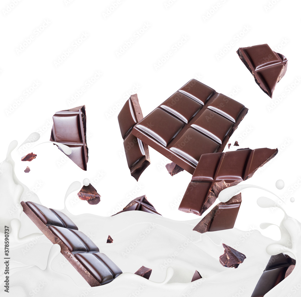 Pieces of chocolate drowning in milk splashes