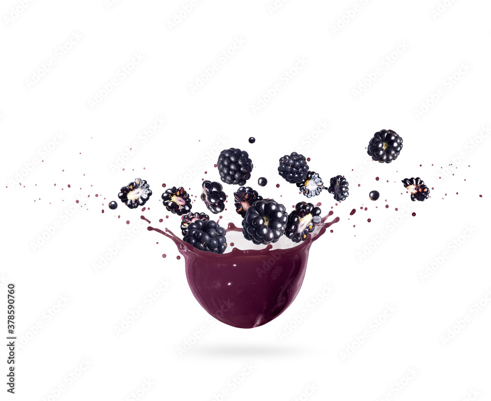 Ripe blackberries with splashes of juice on a white background