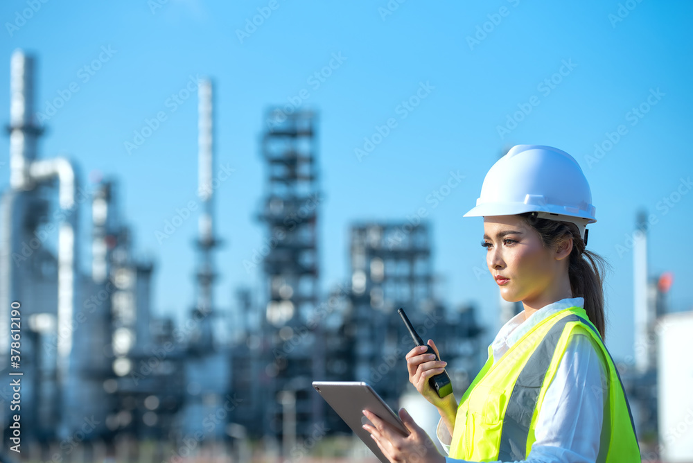 Engineer inspecting in industrial oil refinery. Industry 4.0 concept. Background blurred concept.