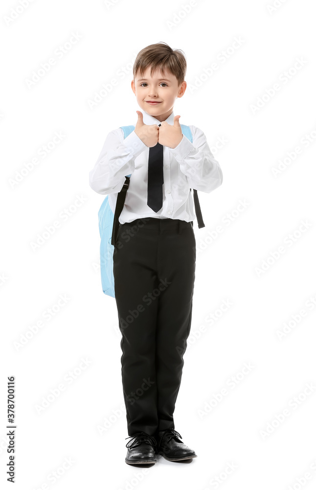 Little schoolboy showing thumb-up on white background