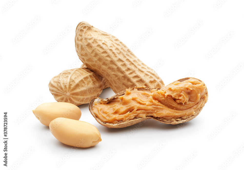 Peanuts and peanut butter spread on white background - clipping path included