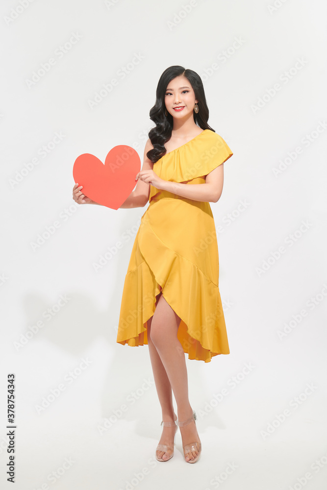 Portrait of attractive, pretty lady look at camera make hold paper red heart in hands isolated on sh