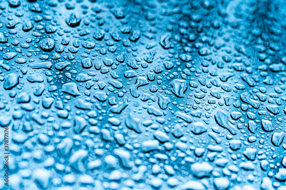 Water drops background. Glass covered with water drops, condensation. Close up.