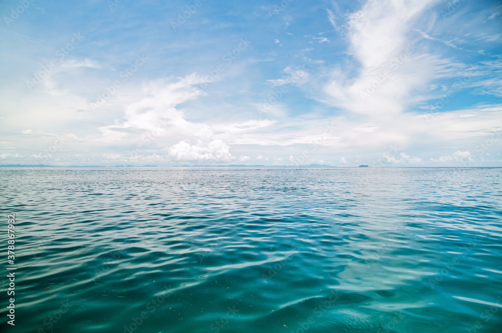 Beautiful scenery view white clouds on blue sky over sea with reflection in the sea surface blue oce