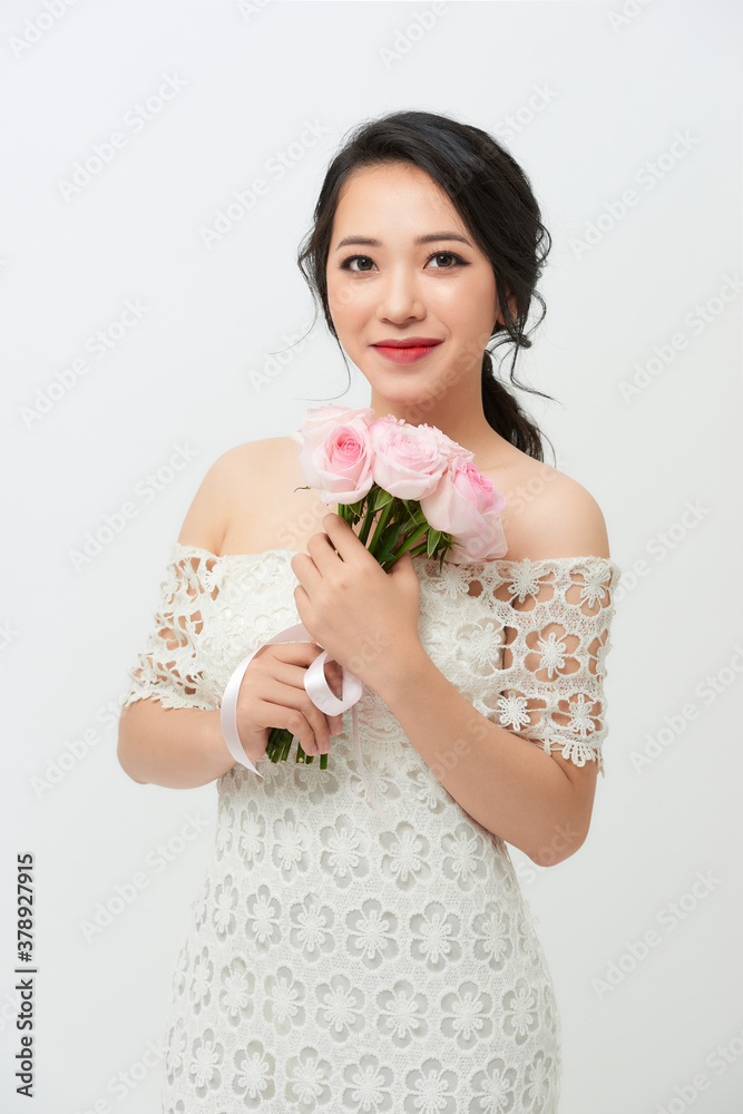 Asian woman is wearing wedding dress on white background