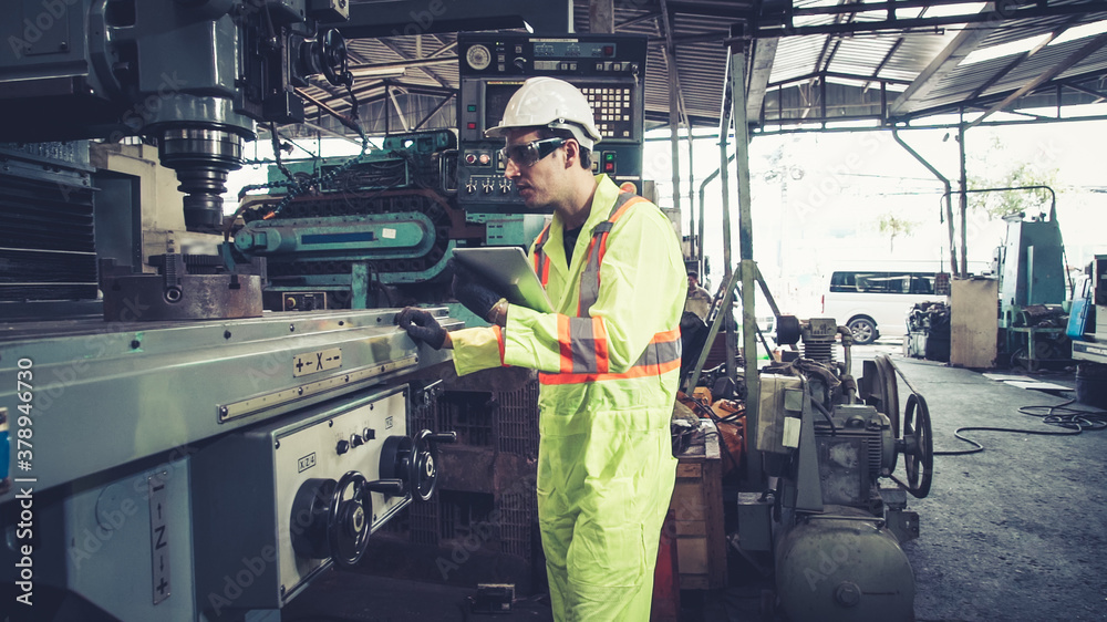 Smart factory worker using machine in factory workshop . Industry and engineering concept.