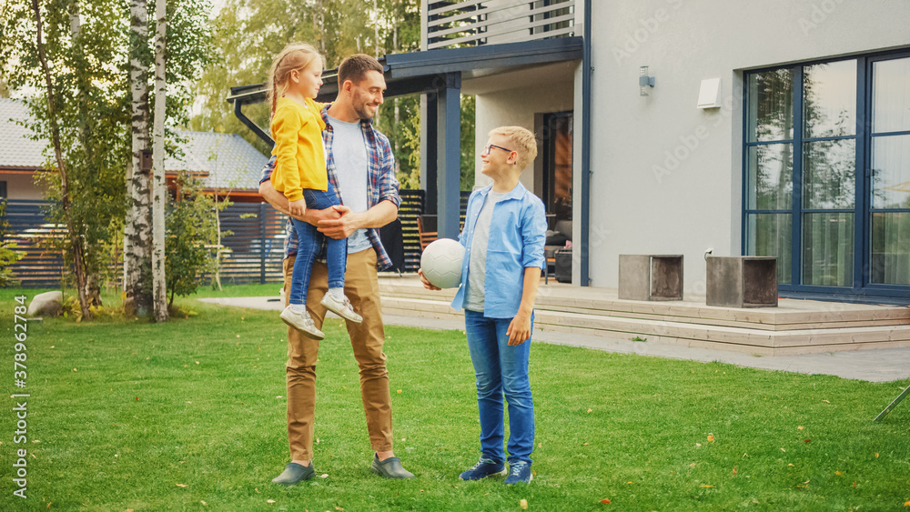 Portrait of a Happy Family of Three: Father, Daughter, Son. They Are Posing In Front of Camera on a 