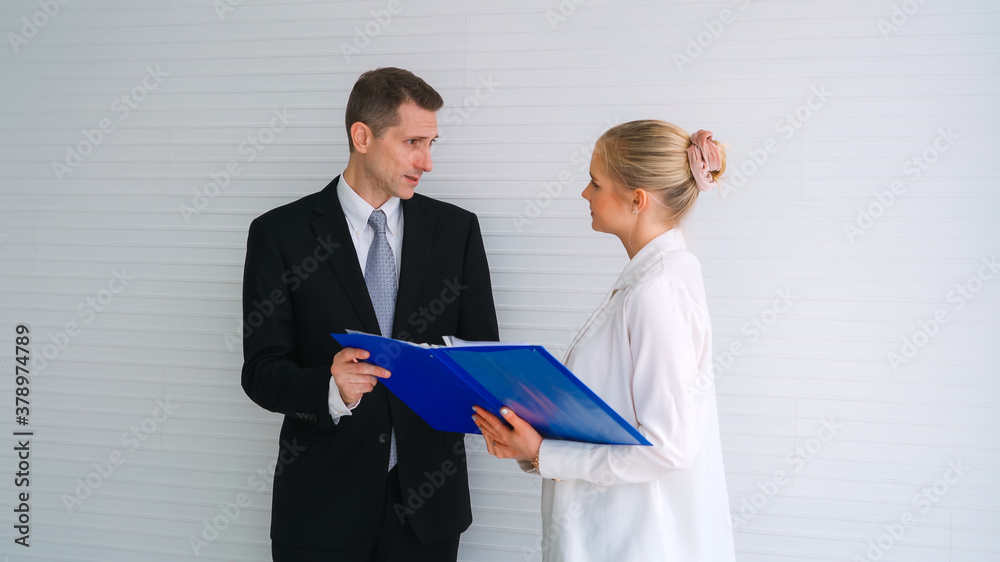 Two business people talk project strategy at office meeting room. Businessman discuss project planni