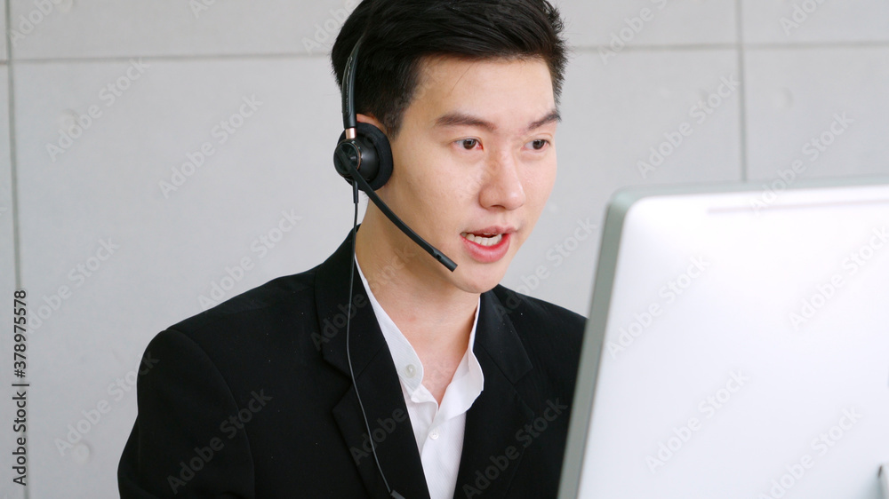 Business people wearing headset working in office to support remote customer or colleague. Call cent