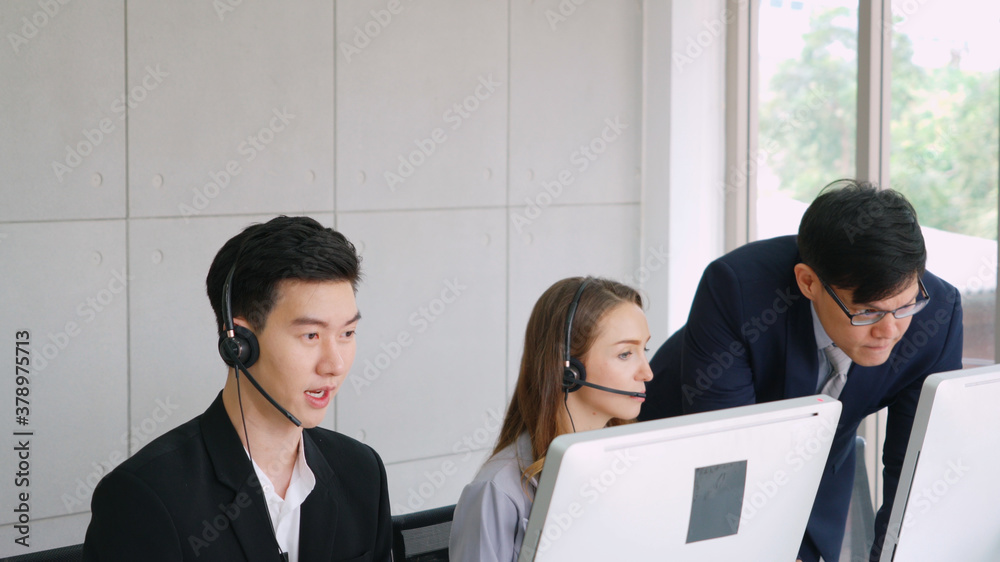 Business people wearing headset working in office to support remote customer or colleague. Call cent