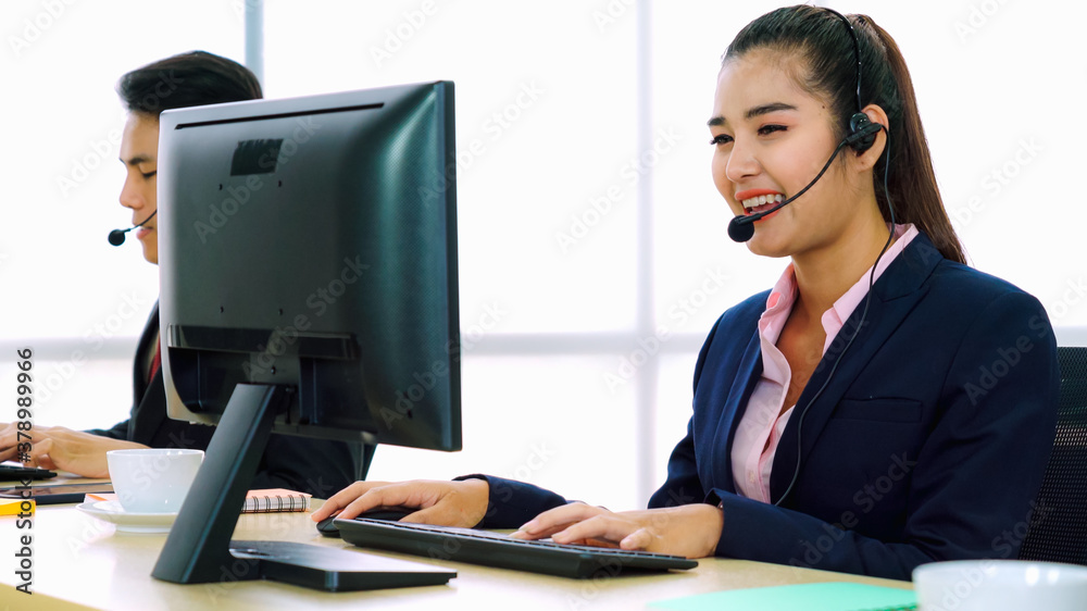 Business people wearing headset working in office to support remote customer or colleague. Call cent