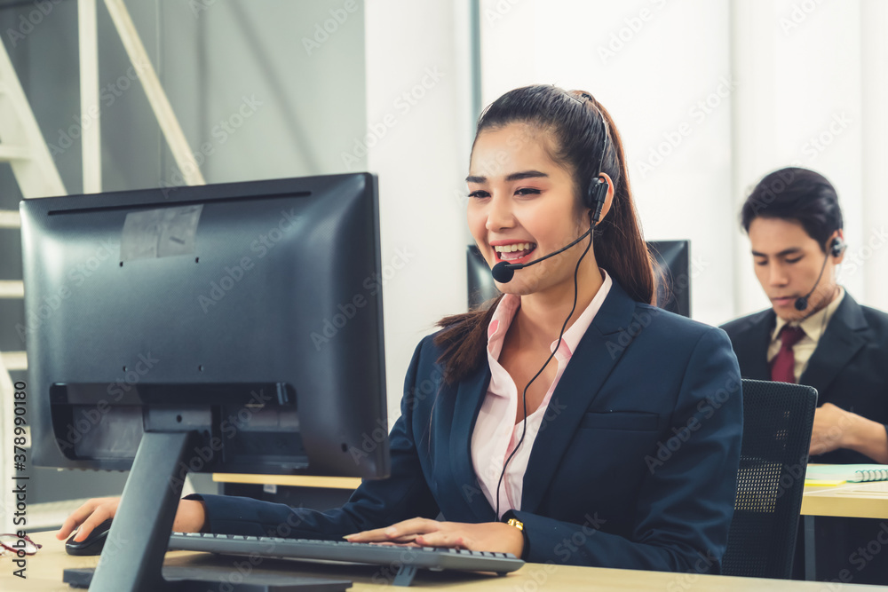 Business people wearing headset working in office to support remote customer or colleague. Call cent