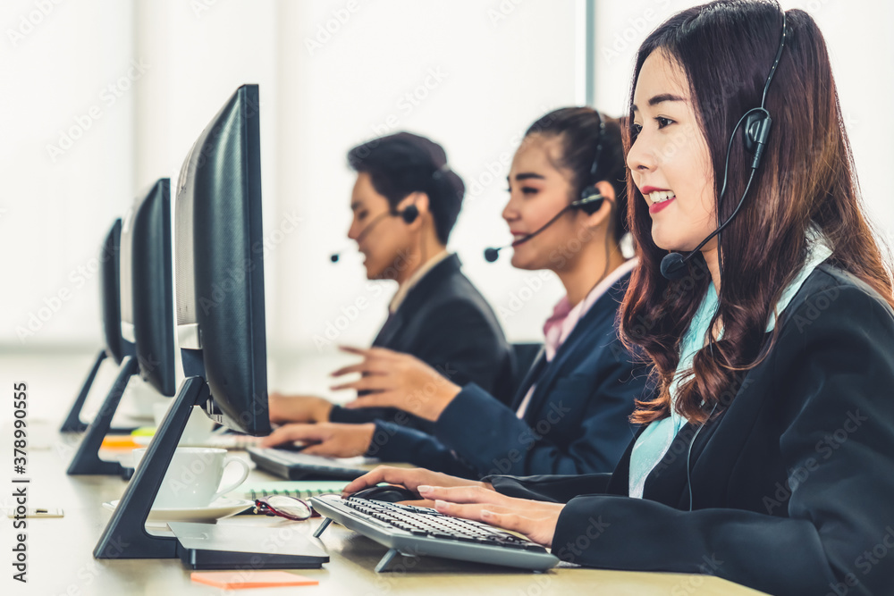 Business people wearing headset working in office to support remote customer or colleague. Call cent