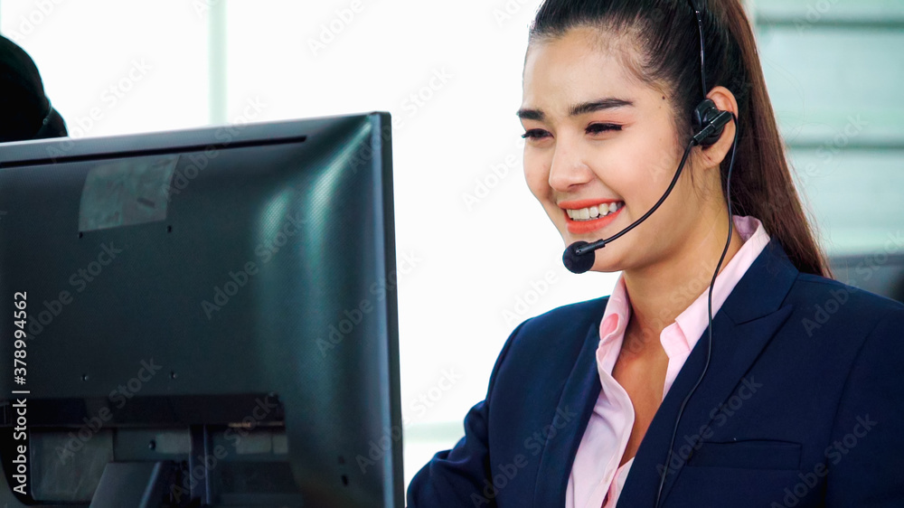 Business people wearing headset working in office to support remote customer or colleague. Call cent