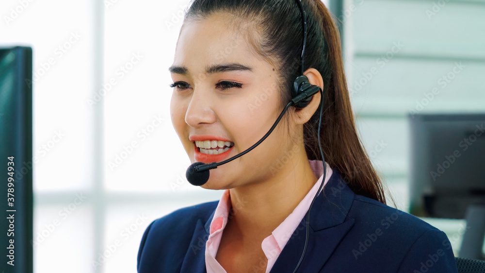 Business people wearing headset working in office to support remote customer or colleague. Call cent