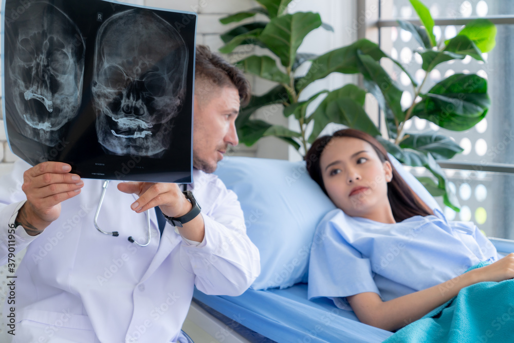 Doctor in professional uniform examining patient at hospital or medical clinic. Health care , medica