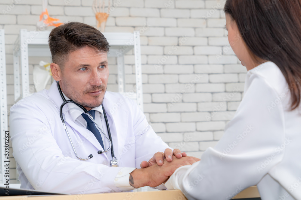 Doctor in professional uniform examining patient at hospital or medical clinic. Health care , medica