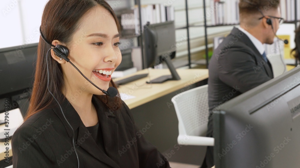 Business people wearing headset working in office to support remote customer or colleague. Call cent