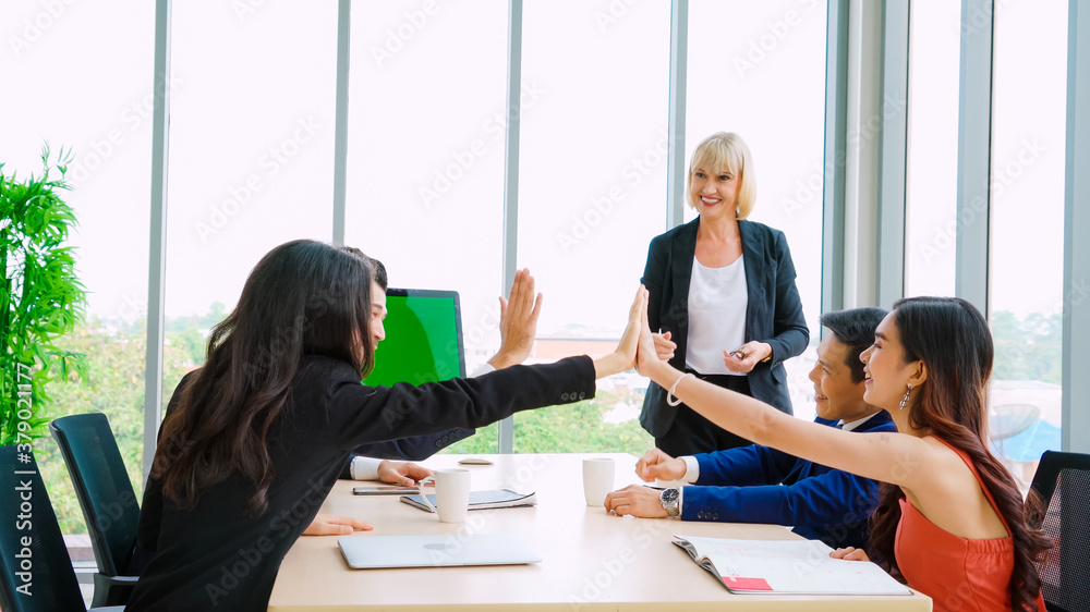 Business people in the conference room with green screen chroma key TV or computer on the office tab