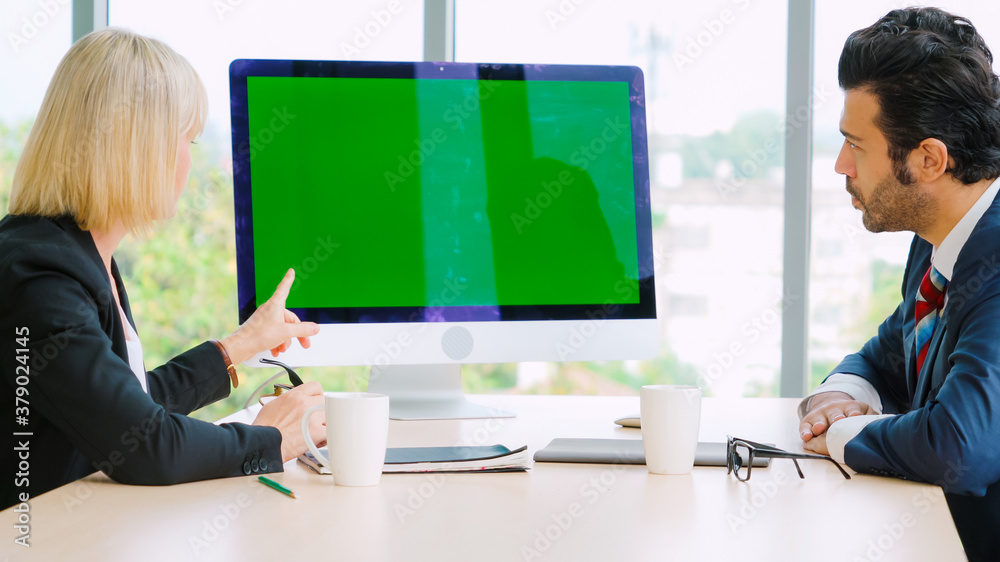 Business people in the conference room with green screen chroma key TV or computer on the office tab