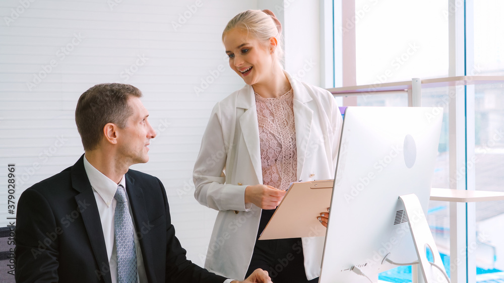 Two business people talk project strategy at office meeting room. Businessman discuss project planni